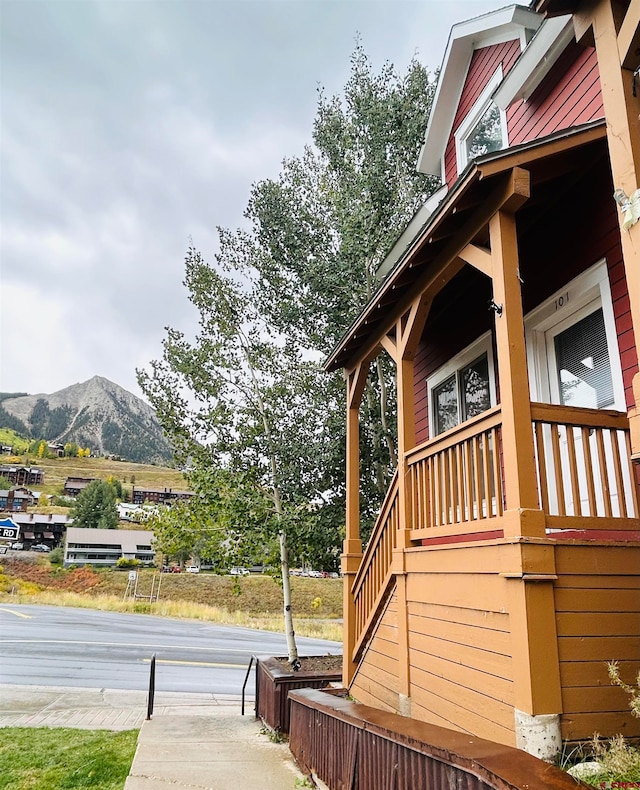 view of side of home with a mountain view