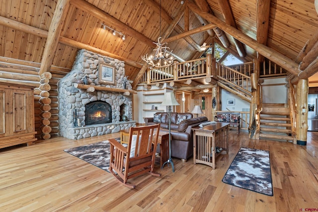 living room featuring high vaulted ceiling, a fireplace, wooden ceiling, hardwood / wood-style floors, and a chandelier