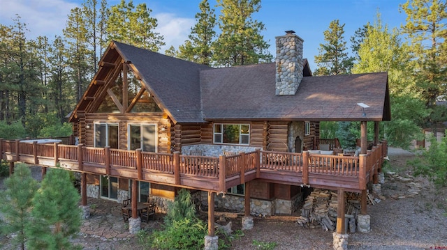 rear view of house with a deck