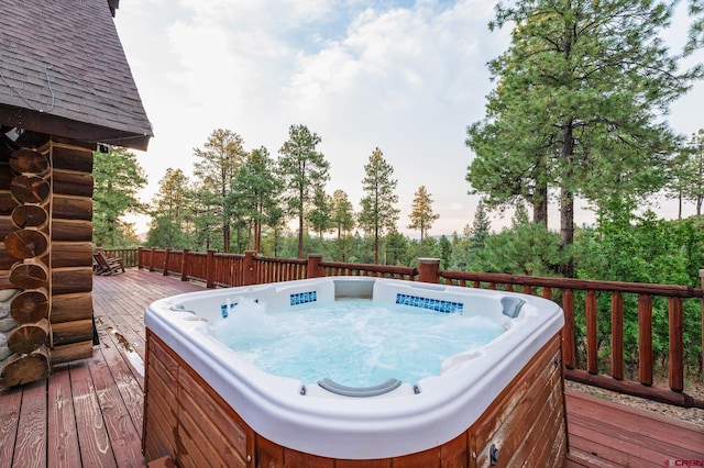 deck with a hot tub