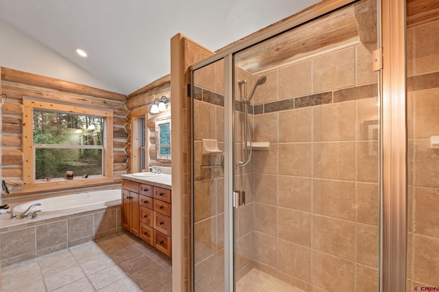 bathroom with independent shower and bath, lofted ceiling, vanity, and tile patterned flooring