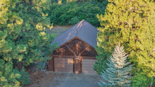 exterior space with an outbuilding and a garage