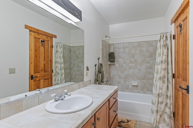 bathroom featuring shower / bath combination with curtain, tile patterned flooring, and vanity