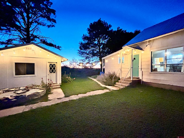 view of yard at dusk