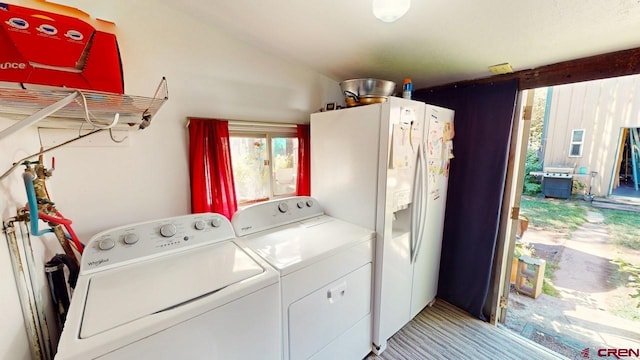 clothes washing area with separate washer and dryer