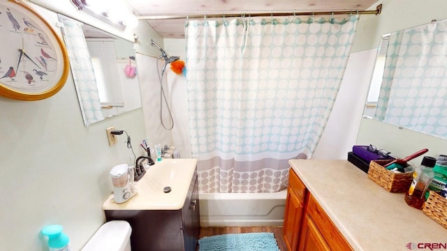 full bathroom featuring vanity, toilet, and shower / bath combination with curtain