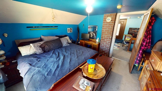 carpeted bedroom with vaulted ceiling