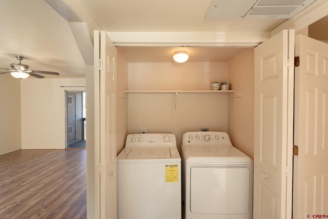 laundry area featuring ceiling fan, washer and clothes dryer, and wood-type flooring