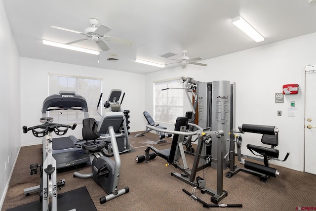 gym with ceiling fan and plenty of natural light