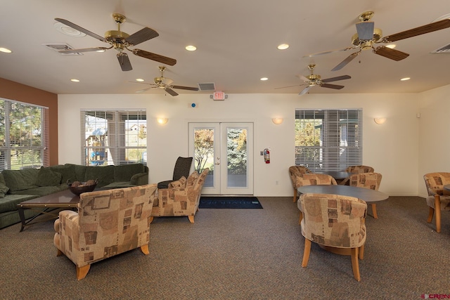 living room featuring ceiling fan, french doors, and a wealth of natural light