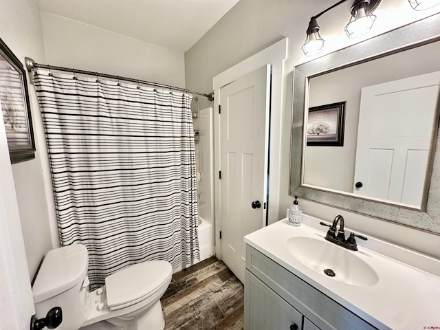 full bathroom with toilet, vanity, shower / bath combo, and wood finished floors
