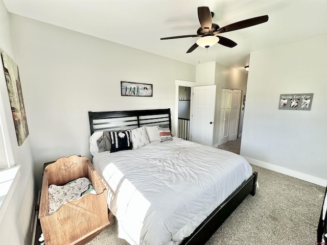 bedroom featuring baseboards, a closet, ceiling fan, and carpet