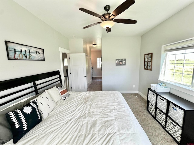 carpeted bedroom featuring ceiling fan