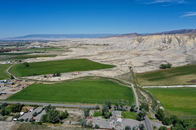 birds eye view of property featuring a mountain view and a rural view