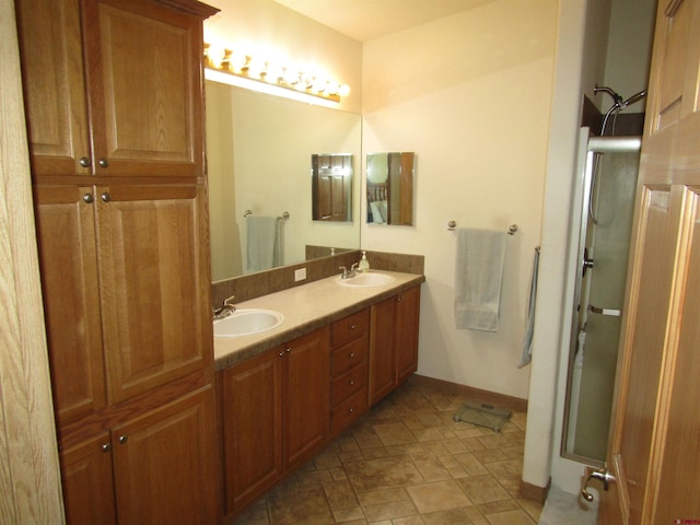 bathroom with walk in shower and vanity