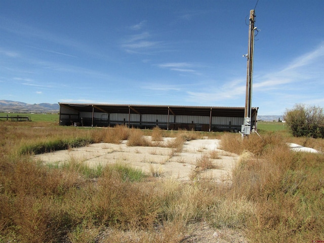 view of outdoor structure with a rural view