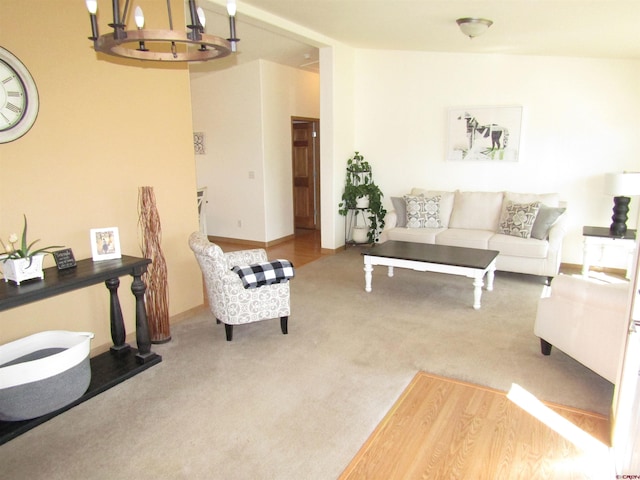 living room with a notable chandelier and carpet floors