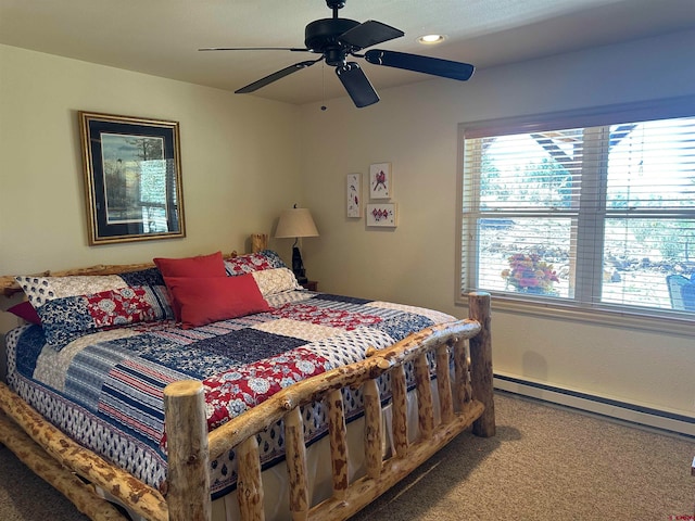 bedroom featuring carpet floors, ceiling fan, and a baseboard radiator