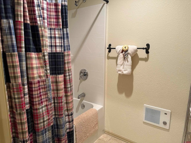bathroom with shower / tub combo, tile patterned flooring, and heating unit