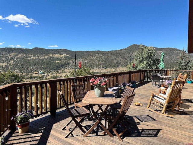 wooden terrace featuring a mountain view
