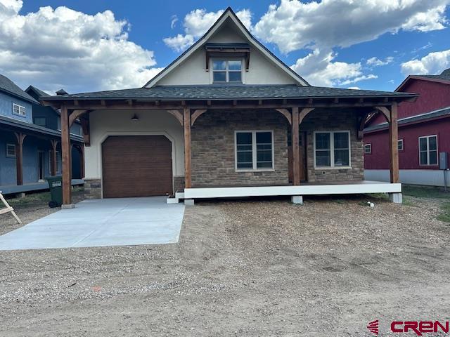 view of front of home with a garage and covered porch