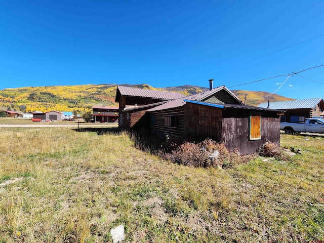 view of home's exterior featuring a mountain view