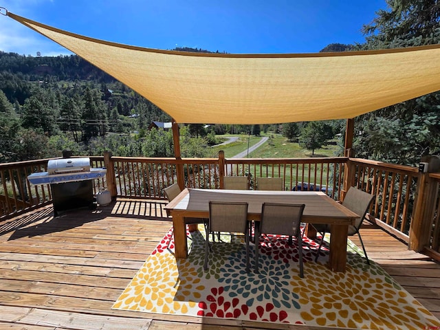 wooden terrace with grilling area