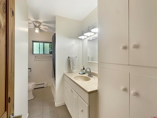 full bathroom featuring a baseboard heating unit, tile patterned flooring, ceiling fan, vanity, and toilet