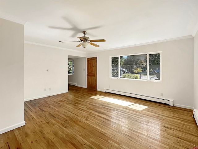 spare room with a baseboard heating unit, ceiling fan, hardwood / wood-style floors, and crown molding