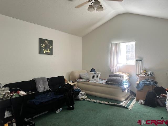 carpeted living room with vaulted ceiling and ceiling fan