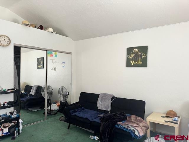 carpeted living room featuring lofted ceiling