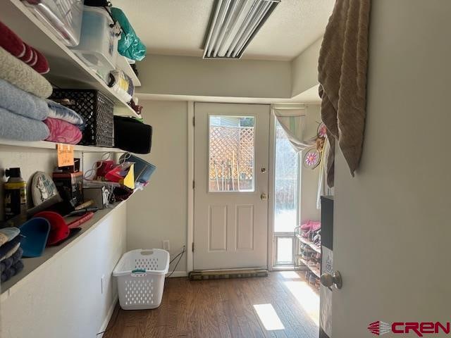 mudroom with hardwood / wood-style floors and a healthy amount of sunlight