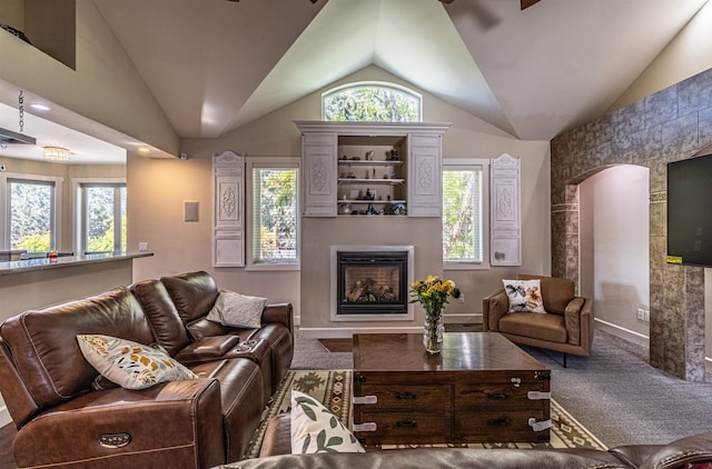 living room with lofted ceiling and carpet floors