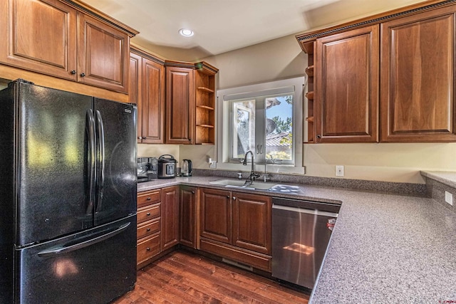 kitchen featuring dishwasher, black refrigerator, dark wood-type flooring, and sink