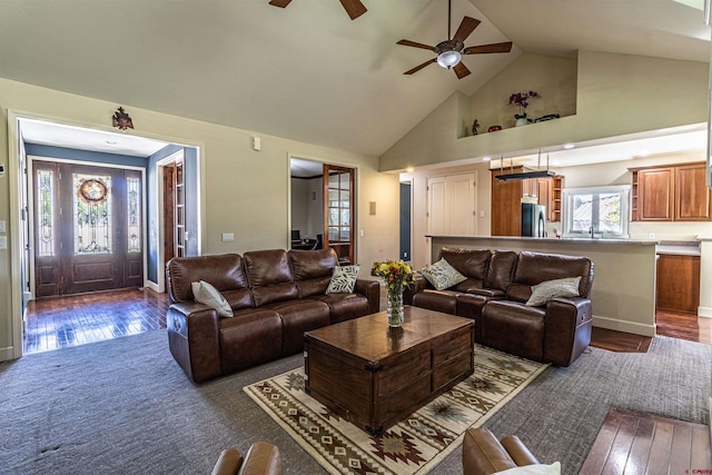 living room featuring high vaulted ceiling, ceiling fan, and dark hardwood / wood-style floors