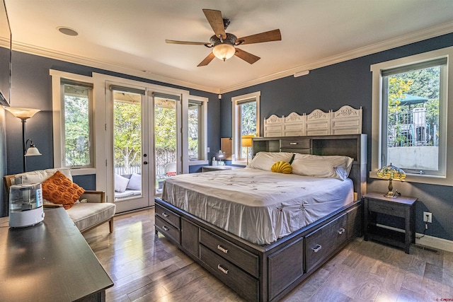 bedroom with access to outside, hardwood / wood-style floors, multiple windows, and ceiling fan