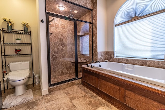 bathroom with separate shower and tub and toilet