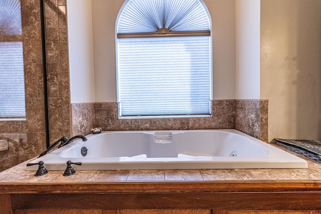 bathroom with tiled tub