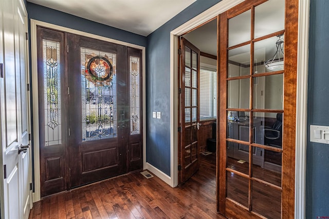 entrance foyer with dark hardwood / wood-style flooring