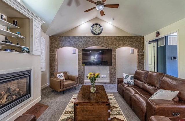 living room with vaulted ceiling, ceiling fan, and dark hardwood / wood-style flooring