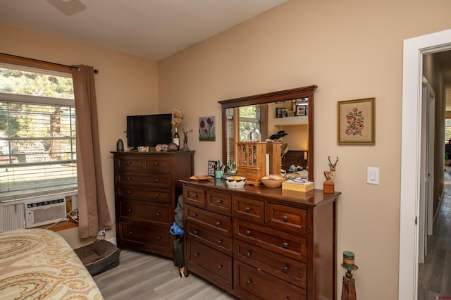 145 Lassen Dr, Pagosa Springs, CO 81147 - bedroom featuring cooling unit, light hardwood / wood-style floors, and multiple windows