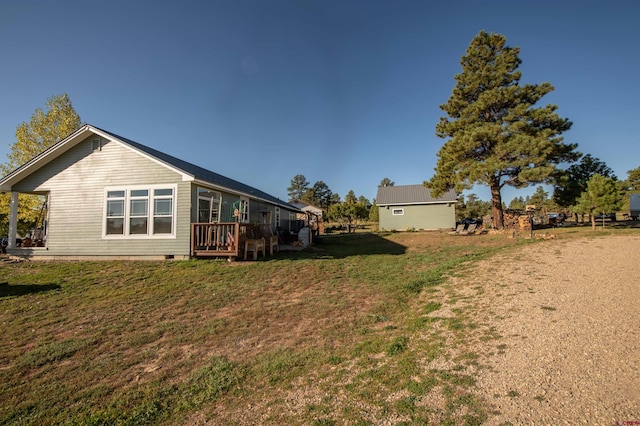 145 Lassen Dr, Pagosa Springs, CO 81147 - exterior space with a wooden deck and a yard