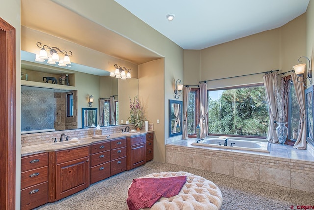 bathroom with shower with separate bathtub and vanity