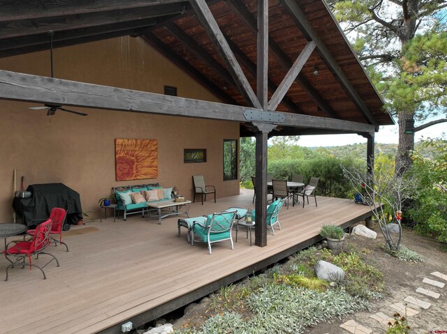 wooden deck featuring an outdoor hangout area, area for grilling, a gazebo, and ceiling fan