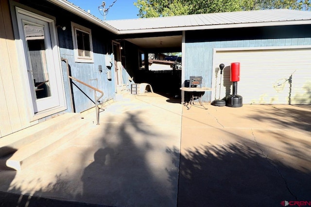 view of patio / terrace with a garage