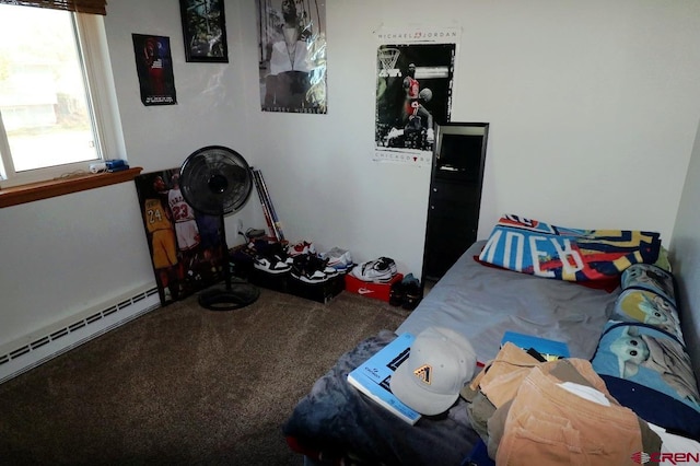 carpeted bedroom with a baseboard heating unit