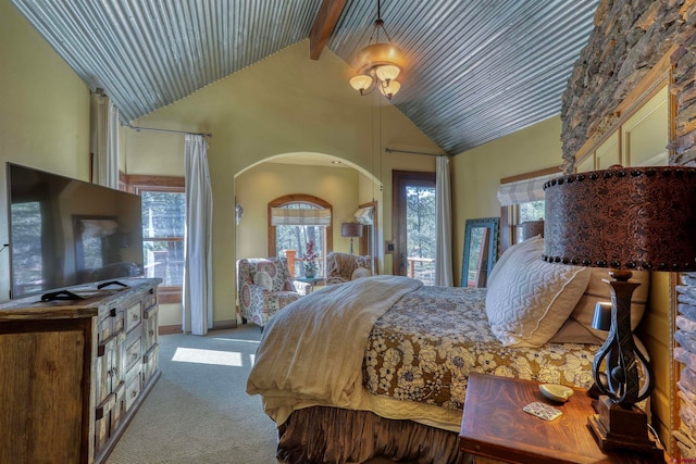 bedroom featuring light colored carpet, beamed ceiling, and high vaulted ceiling