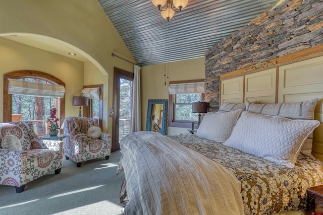 bedroom featuring carpet floors and vaulted ceiling