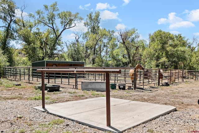 view of property's community with an outdoor structure and a rural view