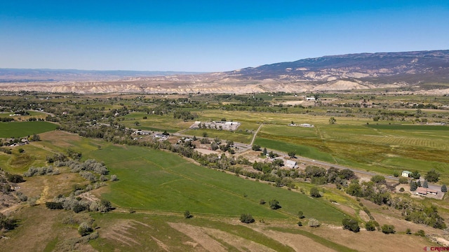 drone / aerial view with a mountain view and a rural view